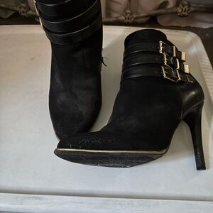 Black leather and suede booties with a 4 inch heel.